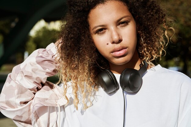 Close up portrait of African woman with headphones