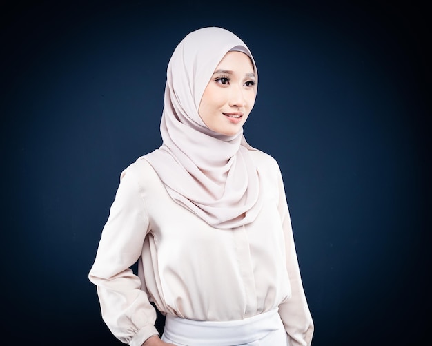 Close up portrait of an Asian Muslim woman in office attire and wearing a hijab