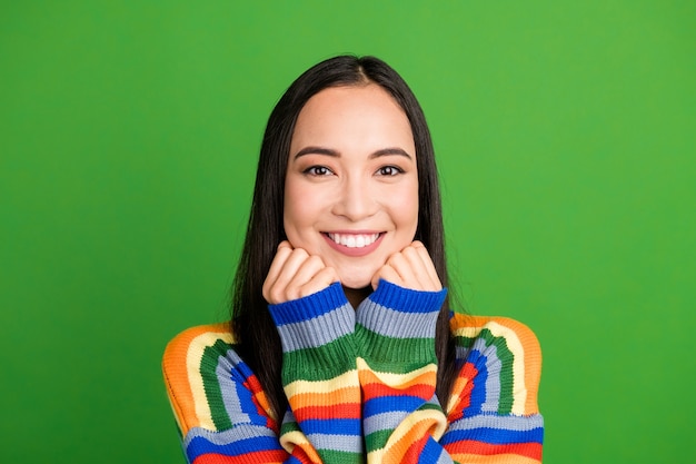 Close-up portrait of attractive content cheerful girl with beaming smile white teeth isolated over bright green color background
