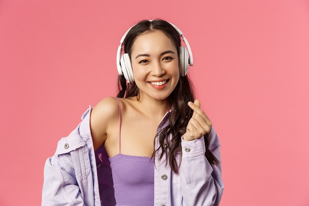 Close-up portrait of attractive happy young modern asian girl