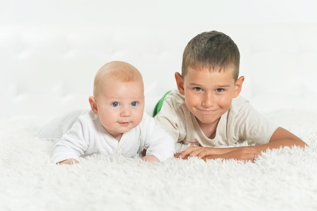 Close up portrait of beautiful boys on a bed