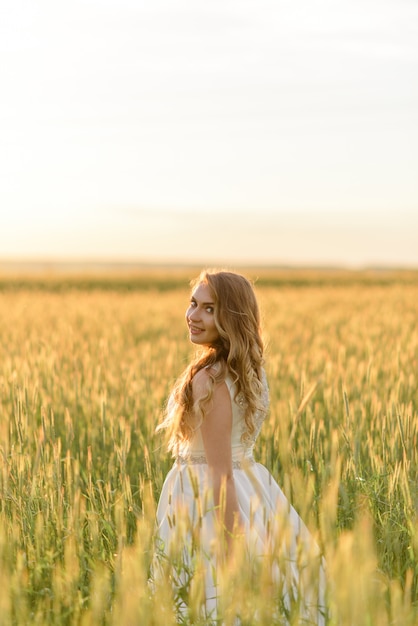 Close-up portrait of a beautiful bride. A woman is looking at the camera over her shoulder.