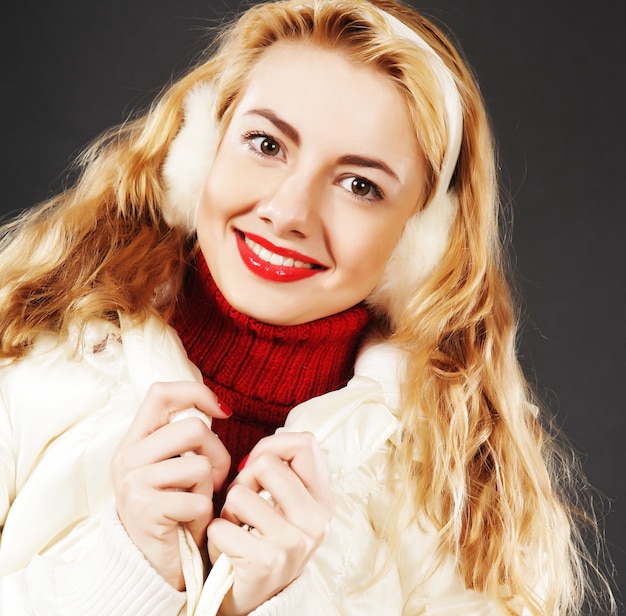 Close-up portrait of beautiful fashion girl wearing warm winter clothing