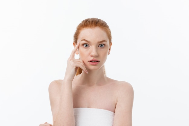 Close-up portrait of beautiful, fresh, healthy and sensual girl over white background