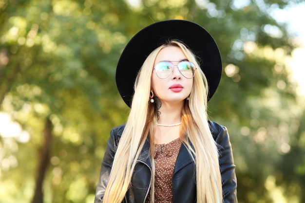 Close up portrait of a Beautiful girl in black hat