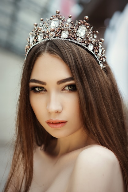 Close up portrait of a beautiful girl with a crown