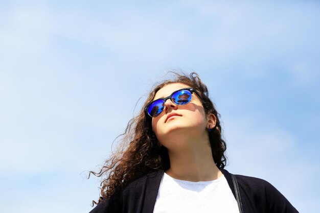 Close-up portrait of beautiful girl with sunglasses