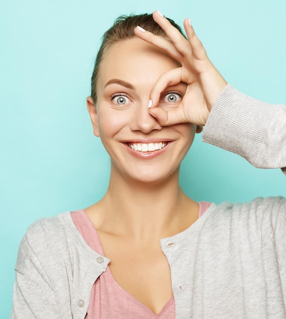 Close up portrait of beautiful joyful woman smiling demonstrating white teeth