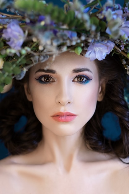 Close-up Portrait of a beautiful spring girl with wreath on head