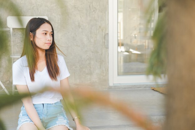 Close up portrait beautiful woman smile and sitting on vacation