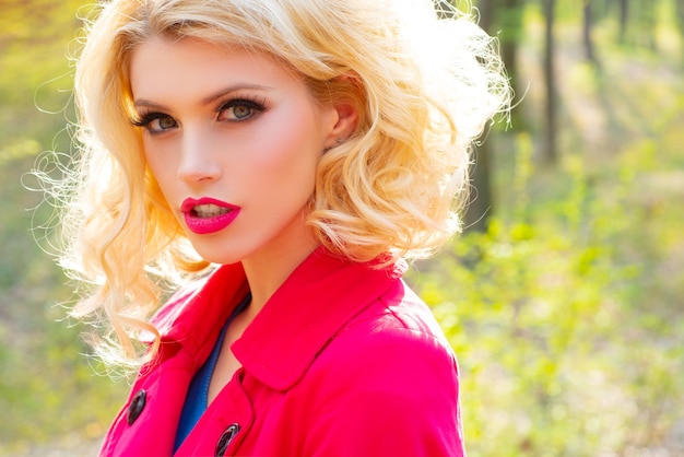 Close up portrait of a beautiful and young woman enjoying sunny day outdoors spring makeup