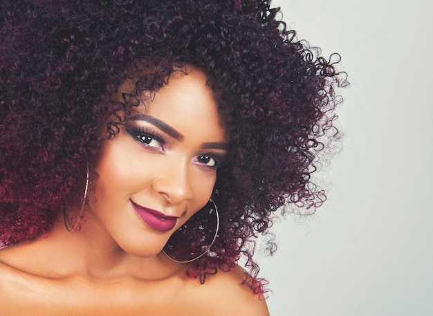 Close-up portrait of beautiful young woman over white background