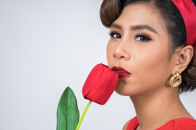 Close-up portrait of a beautiful young woman over white background