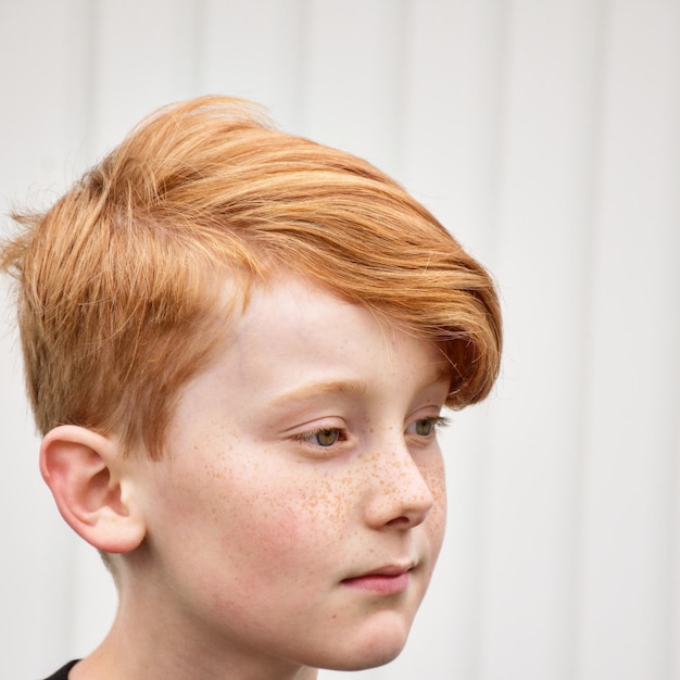 close-up portrait of boy looking away