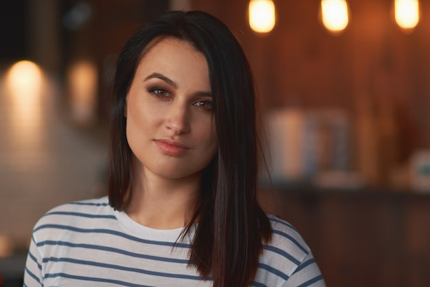 Close up portrait brunette girl at home