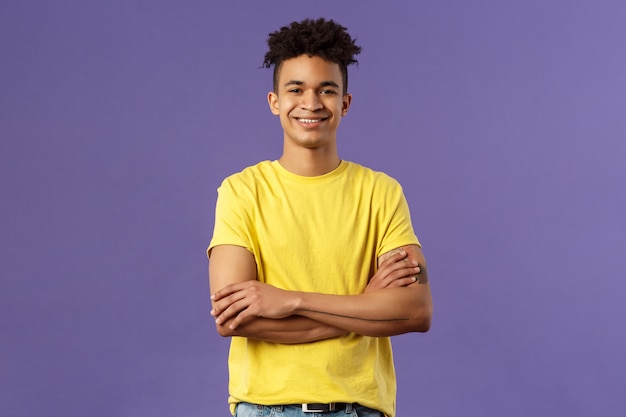 Close-up portrait of confident, smart and professional young male student with dreads