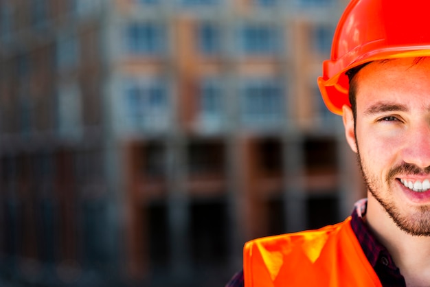 Close up portrait of construction worker looking at camera