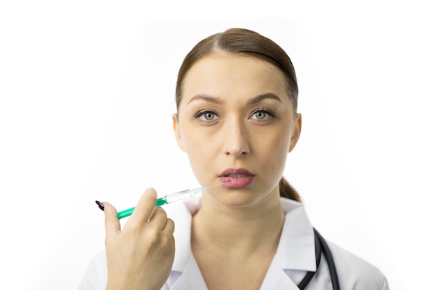 Close up portrait of cosmetologist making botox injections in lips, augmentation