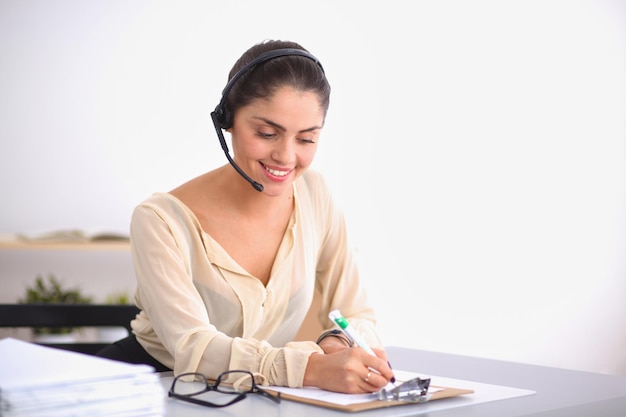 Close-up portrait of a customer service agent sitting at office