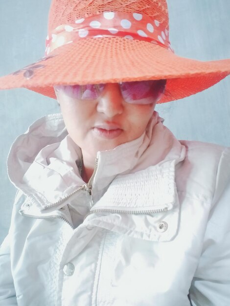 Close-up portrait of cute baby girl wearing hat