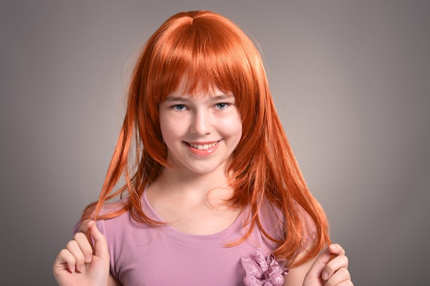 Close up portrait of cute girl with red hair posing