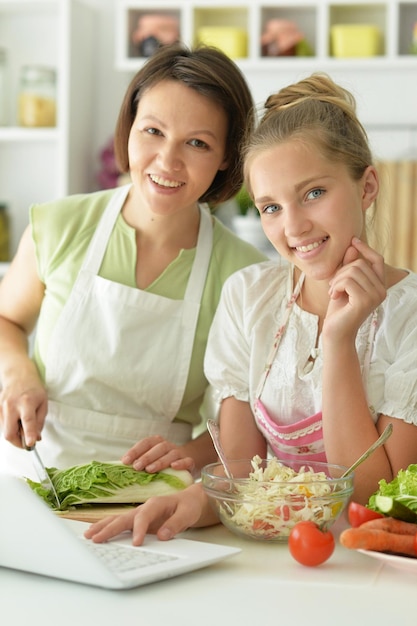 Close up portrait of cute little girl with mother