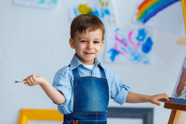 Close-up portrait of cute, smiling, white three years old boy in