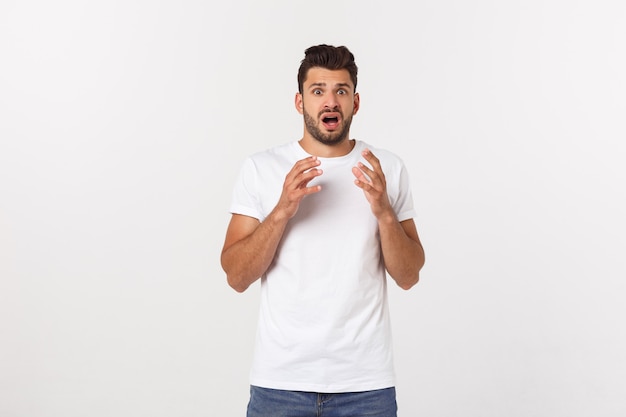 Close up portrait of disappointed stressed bearded young man in shirt over  