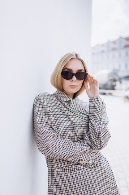 Close up portrait of fashionblondie young woman in sunglasses