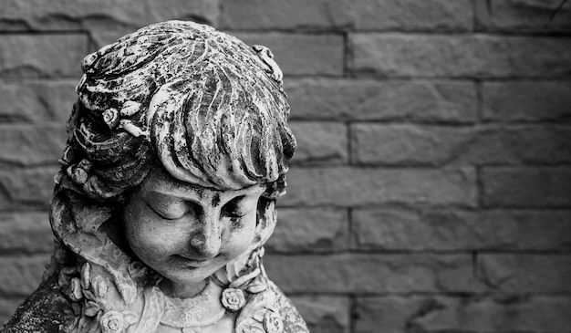 Close-up portrait of a girl against wall