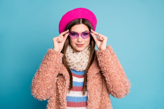 Close-up portrait of girl putting on specs