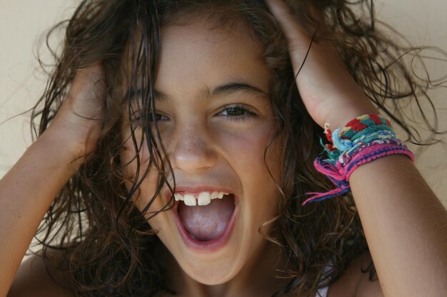 Close-up portrait of girl shouting