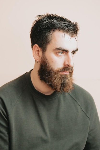 Close up portrait of a handsome man with mental health problems disappointed stressed bearded young man over isolated backgroundlooking serious straight to camera Depression and anxiety