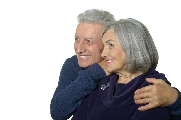 Close up portrait of a happy senior couple on white background