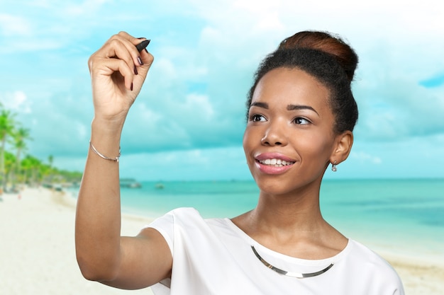 Close up portrait of a happy woman pointing