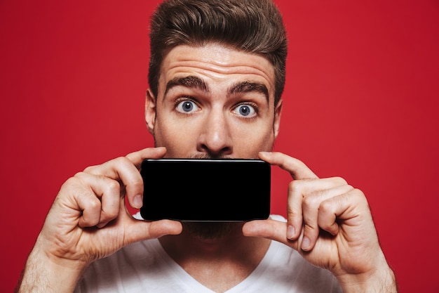 Close up portrait of a happy young bearded man