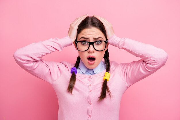 Close-up portrait of her she attractive pretty worried caucasian overwhelmed brown-haired girl nerd terrible fake news information reaction isolated over pink pastel color background