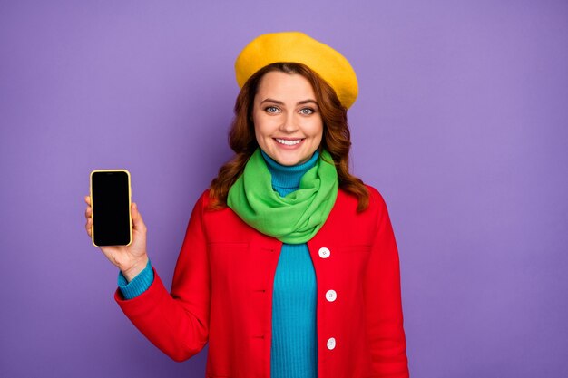 Close-up portrait of her she nice-looking attractive lovely cheerful cheery wavy-haired girl demonstrating new digital device isolated over violet lilac purple pastel color background