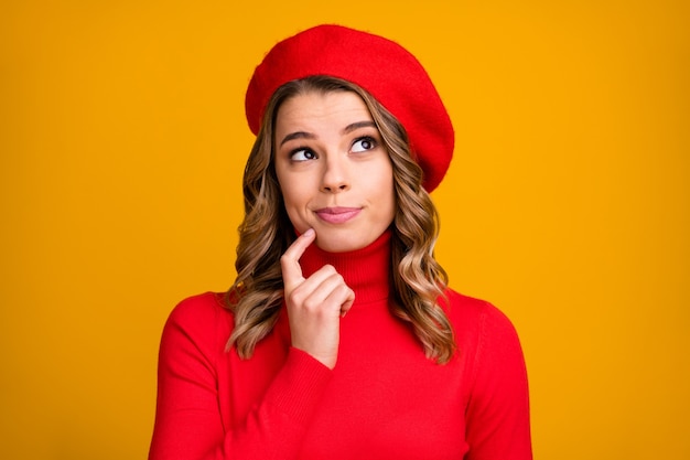 Close-up portrait of her she nice-looking attractive lovely cute sweet smart clever cheery wavy-haired girl overthinking choosing options isolated on bright vivid shine vibrant yellow color background