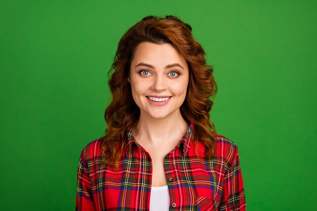 Close-up portrait of her she nice-looking attractive lovely pretty cute cheerful wavy-haired girl wearing checked shirt isolated over bright vivid shine vibrant green color background