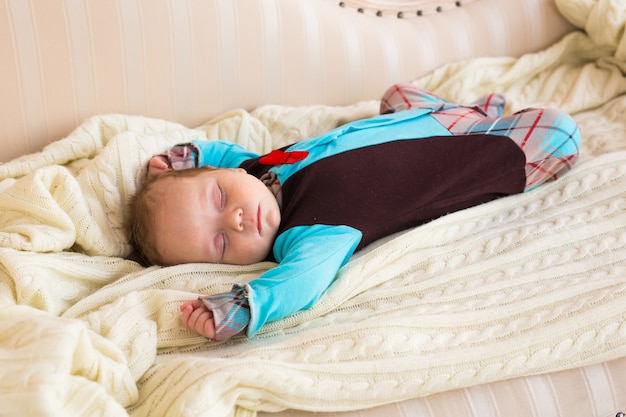 Close-up portrait of infant baby boy sleeping