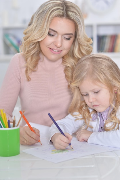 Close up portrait of little cute girl with mother