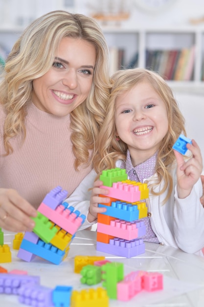 Close up portrait of little girl and her mother