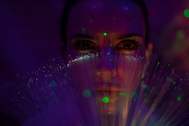 close-up portrait of man against illuminated background