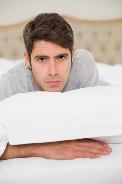 Close up portrait of a man resting in bed