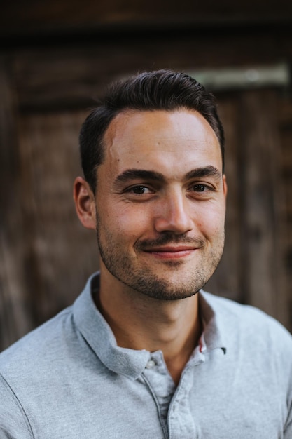 Close-up portrait of man smiling outdoors