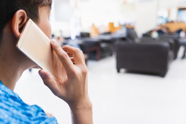 Close-up portrait of man using mobile phone