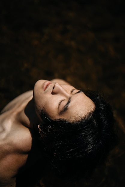 close-up portrait of mid adult woman with eyes closed