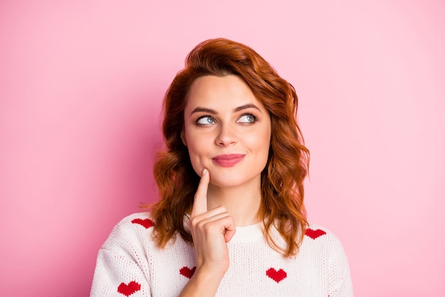 Close-up portrait   nice attractive cheerful  girl wearing white pullover with hearts