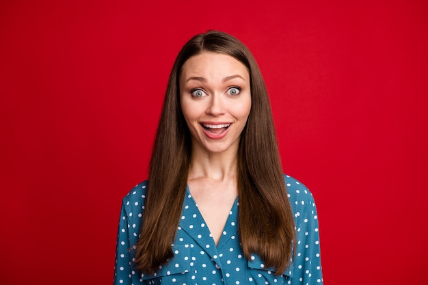 Close-up portrait of nice-looking lovely amazed cheerful girl good news reaction isolated bright red color background